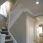 Freshly painted interior stairwell and hallway showing how to prepare your home for a professional interior painting project