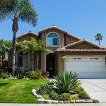 Freshly painted stucco home in Florida illustrating what affects how long exterior paint lasts on a home in Fort Myers