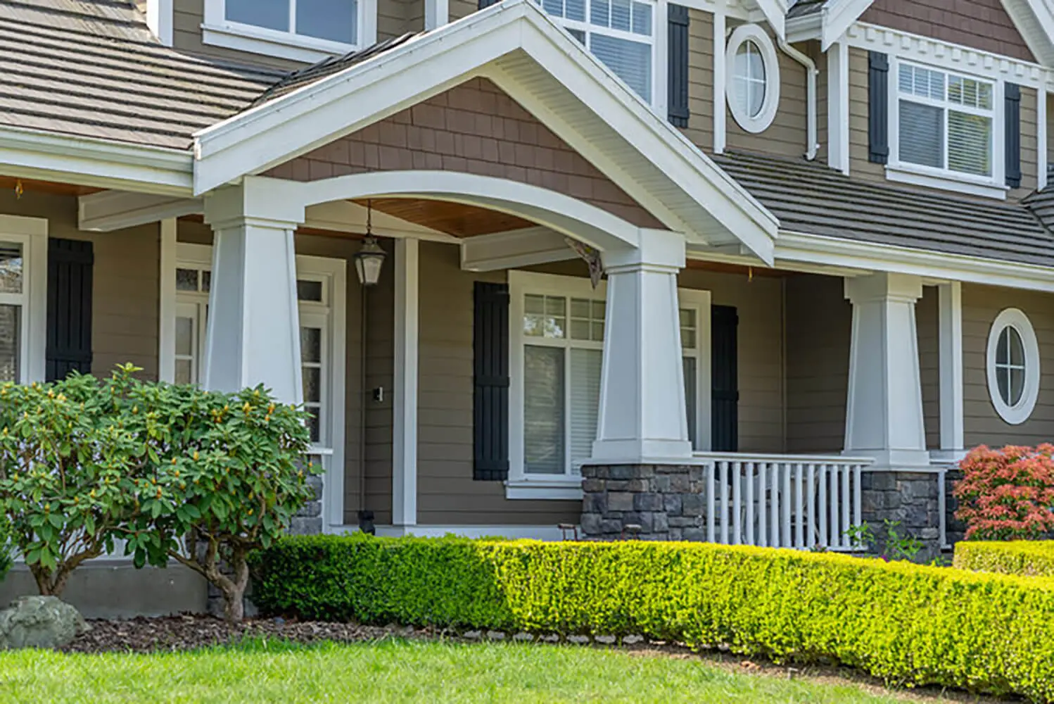 Freshly painted coastal-style home exterior in neutral tones showing ideal results during the best time to paint a home exterior in Fort Myers