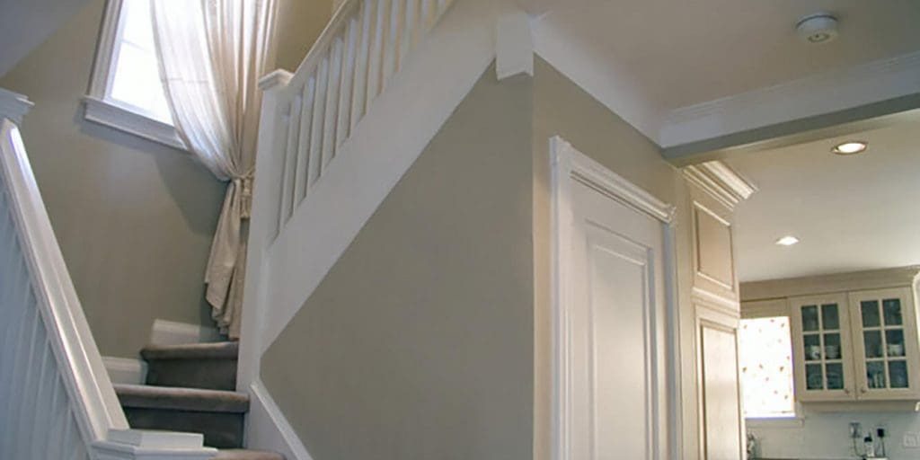Freshly painted interior stairwell and hallway showing how to prepare your home for a professional interior painting project