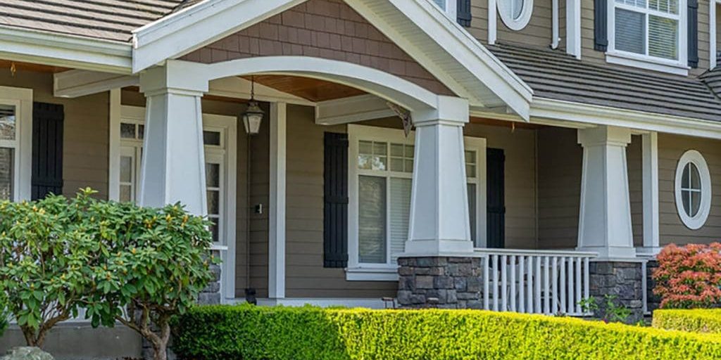 Freshly painted coastal-style home exterior in neutral tones showing ideal results during the best time to paint a home exterior in Fort Myers